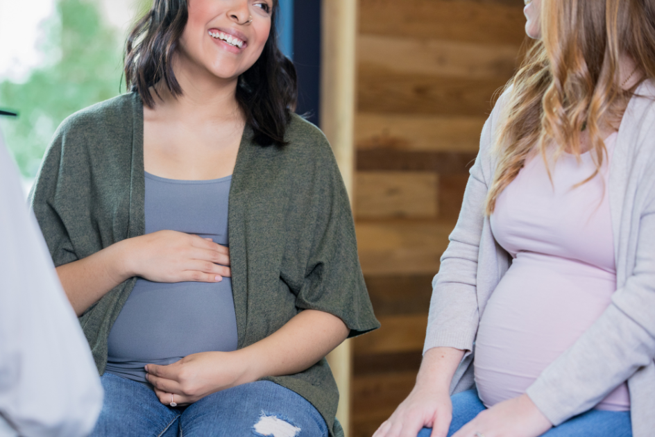 Two pregnant women talking